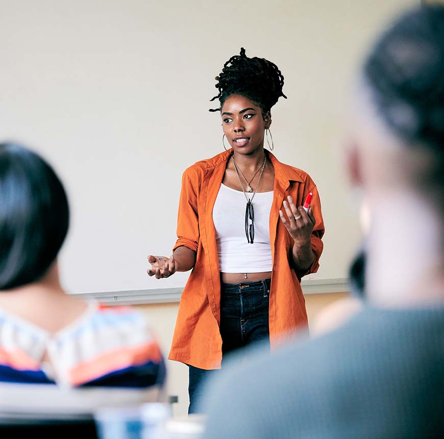 woman speaking in front of classroom