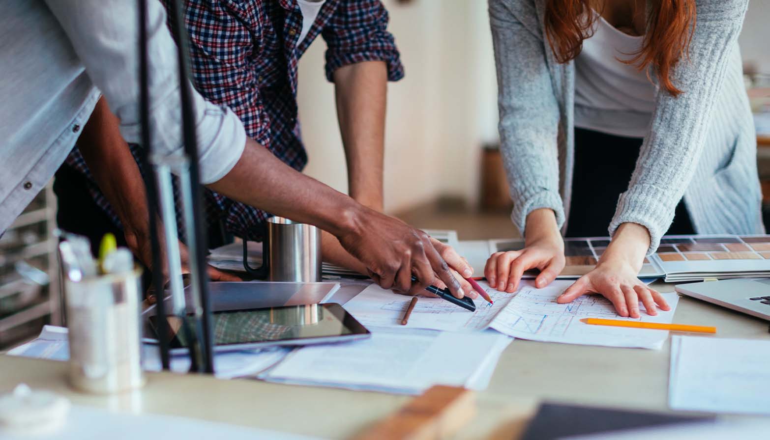 team looking at plans together